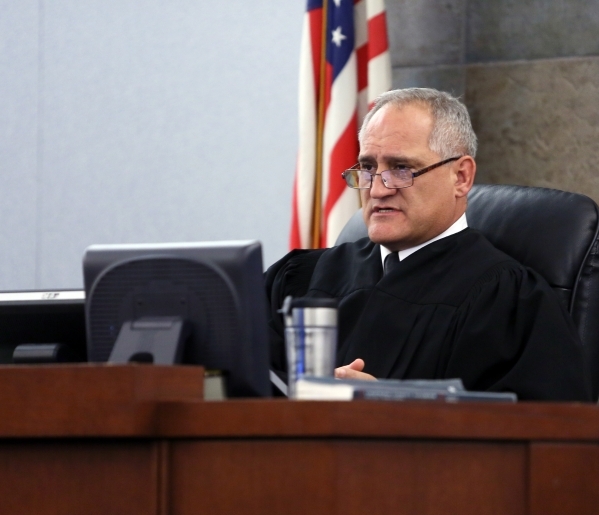 Judge Joseph Sciscento presides over a trial at Regional Justice Center Thursday, Nov. 21, 2013, in Las Vegas. Schlacta, who is a California ex-convict, was charged with sexually assaulting at kni ...
