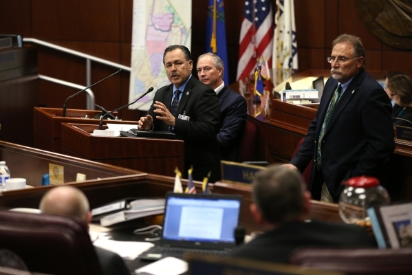 Gov. Brian Sandoval administration officials, from left, Rudy Malfabon, Steve Hill and Mike Willden testify before the Nevada Senate Committee of the Whole at the Legislative Building in Carson Ci ...