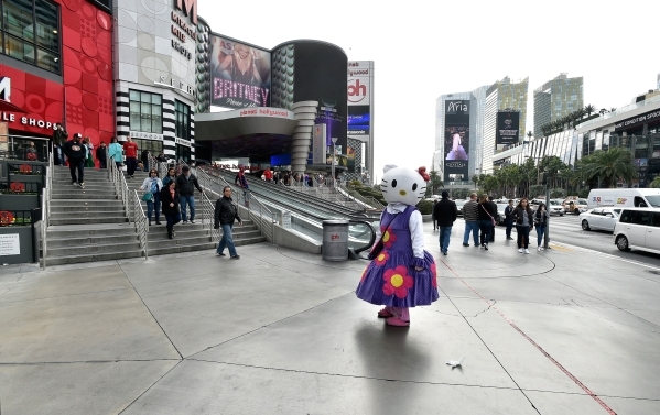A Hello Kitty character waits to be photographed in front of the Planet Hollywood hotel-casino Monday, Dec. 21, 2015, where police said a car driven by Lakeisha N. Holloway, of Oregon, smashed int ...