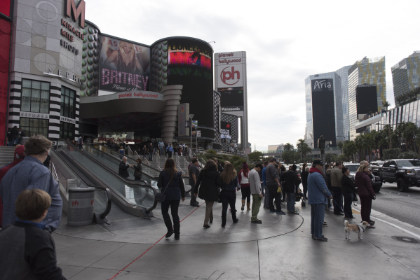 Pedestrians walk on the sidewalk in front of Planet Hollywood Resort & Casino in Las Vegas Monday, Dec. 21, 2015. Jason Ogulnik/Las Vegas Review-Journal.