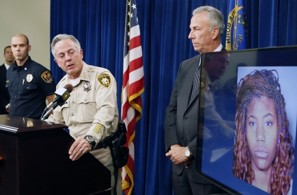 A Sunday night car crash suspect Lakeisha Holloway‘s photo, right, was displayed as Clark County Sheriff Joe Lombardo speaks about the crash on the Strip during a news conference at Las Vega ...