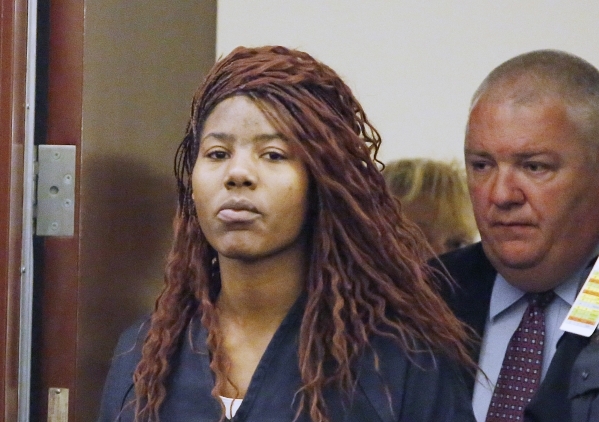 Lakeisha Holloway, charged in Sunday‘s fatal crash on the Las Vegas Strip, and Deputy Public Defender Scott Coffee, right, enter the courtroom during Halloway‘s initial court appearanc ...