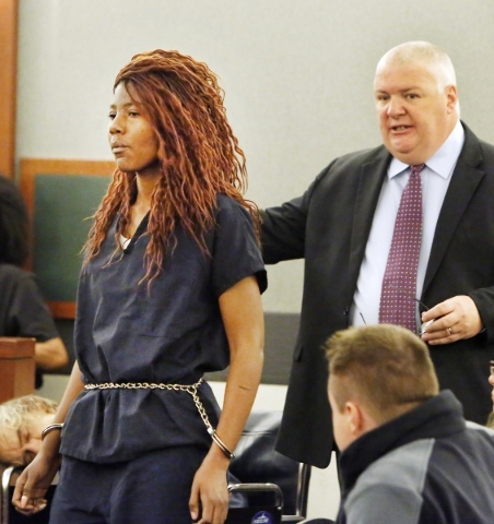 Lakeisha Holloway, charged in Sunday‘s fatal crash on the Las Vegas Strip, left, and Deputy Public Defender, Scott Coffee, enter the courtroom during Halloway‘s initial court appearanc ...
