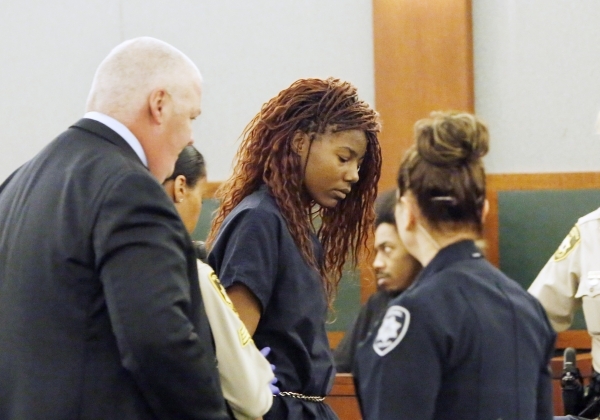 Lakeisha Holloway, charged in Sunday‘s fatal crash on the Las Vegas Strip, center, led out of the courtroom after her initial court appearance at the Regional Justice Center on Wednesday, De ...