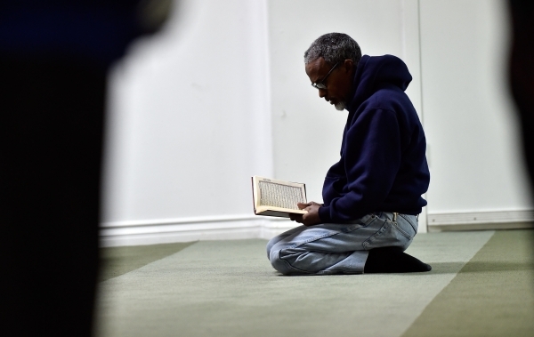 Abdelkadr Seid prays at Masjid-e-Tawheed Tuesday, Dec. 29, 2015, in Las Vegas. A Muslim civil rights group is calling for a federal and state hate crime investigation after the door handles of the ...