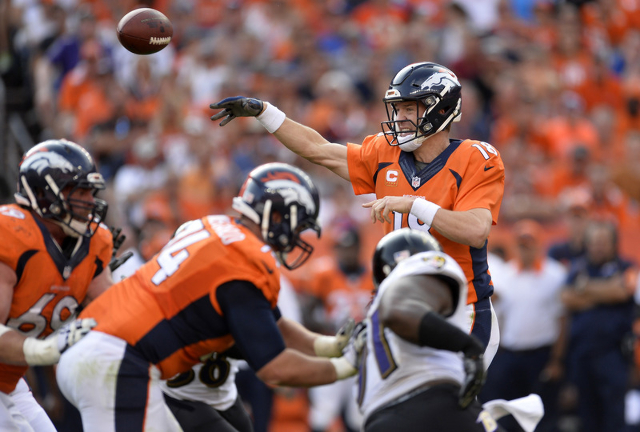 Sep 13, 2015; Denver, CO, USA; Denver Broncos quarterback Peyton Manning (18) passes the ball in the fourth quarter against the Baltimore Ravens at Sports Authority Field at Mile High. The Broncos ...