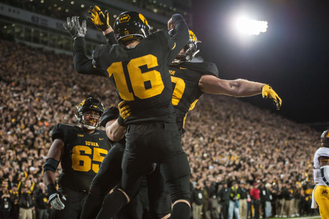 Nov 14, 2015; Iowa City, IA, USA; Iowa Hawkeyes quarterback C.J. Beathard (16) and tight end Henry Krieger Coble (80) celebrate a touchdown during the first half against the Minnesota Golden Gophe ...