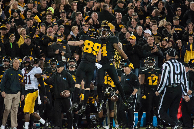 Nov 14, 2015; Iowa City, IA, USA; Iowa Hawkeyes wide receiver Tevaun Smith (4) and wide receiver Matt VandeBerg (89) celebrate during the second half against the Minnesota Golden Gophers at Kinnic ...