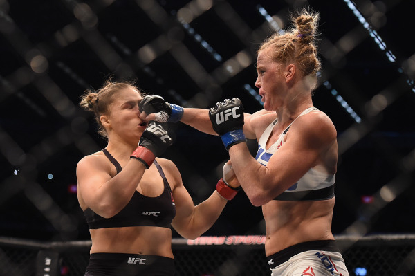 Nov 15, 2015; Melbourne, Australia; Ronda Rousey (red gloves) competes against Holly Holm (blue gloves) during UFC 193 at Etihad Stadium. (Matt Roberts/USA Today Sports)