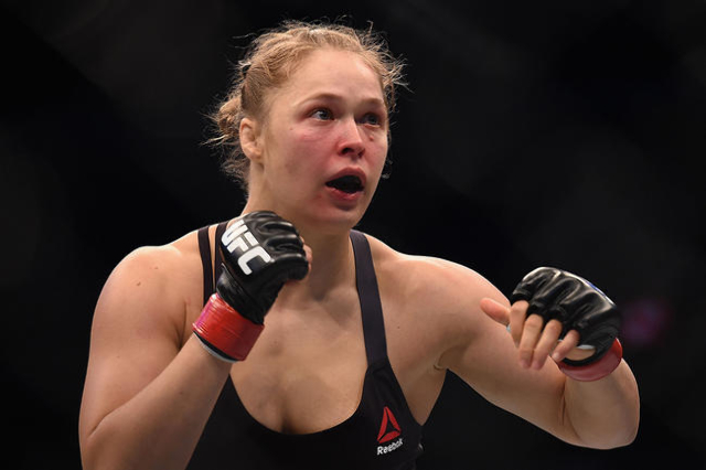 Nov 15, 2015; Melbourne, Australia; Ronda Rousey (red gloves) competes against Holly Holm (not pictured) during UFC 193 at Etihad Stadium. (Matt Roberts/USA Today Sports)