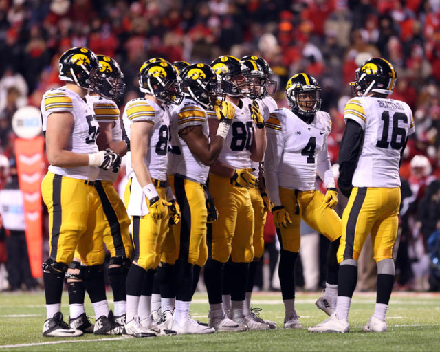 Nov 27, 2015; Lincoln, NE, USA; Iowa Hawkeyes quarterback C.J. Beathard (16) talks to his offense during the fourth quarter against the Nebraska Cornhuskers at Memorial Stadium. Iowa beat Nebraska ...