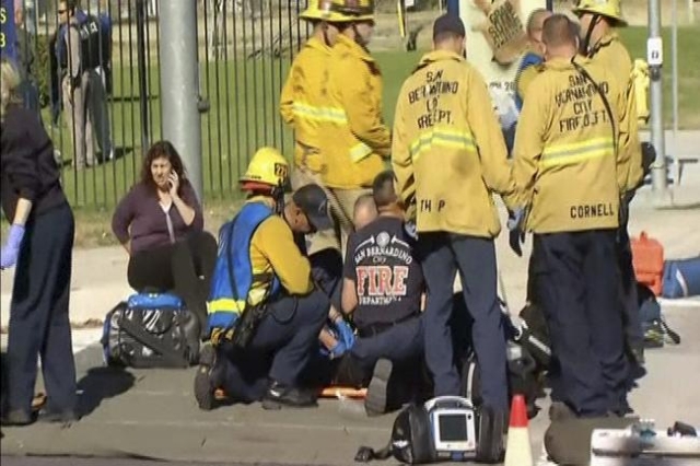 Rescue crews tend to the injured in the intersection outside the Inland Regional Center in San Bernardino, California in this still image taken from video December 2, 2015. REUTERS/NBCLA.com/Hando ...