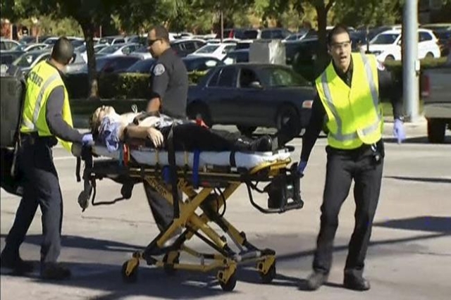 Rescue crews tend to the injured in the intersection outside the Inland Regional Center in San Bernardino, California in this still image taken from video December 2, 2015. REUTERS/NBCLA.com/Hando ...