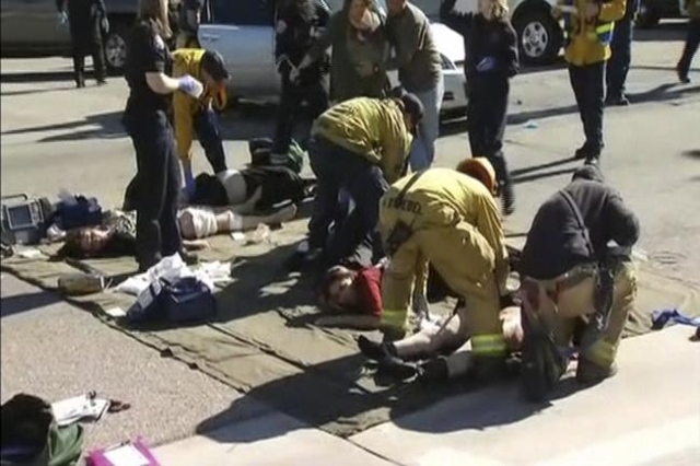 Rescue crews tend to the injured in the intersection outside the Inland Regional Center in San Bernardino, California in this still image taken from video December 2, 2015. REUTERS/NBCLA.com/Hando ...