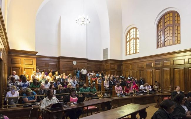 Onlookers wait for Judge Eric Leach to deliver judgement in the Oscar Pistorius case in the Supreme Court of Appeal in Bloemfontein, December 3, 2015. Paralympian Pistorius‘ conviction for k ...