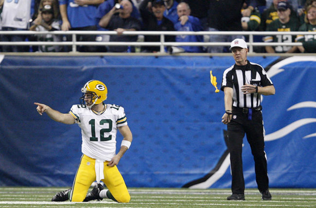 Dec 3, 2015; Detroit, MI, USA; Green Bay Packers quarterback Aaron Rodgers (12) points to his right during the first quarter against the Detroit Lions at Ford Field. Mandatory Credit: Raj Mehta-US ...
