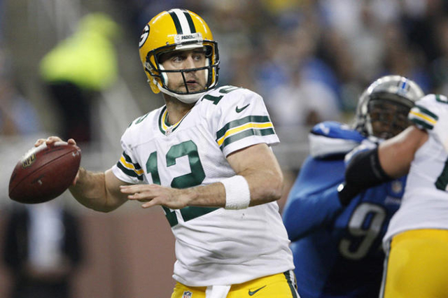 Dec 3, 2015; Detroit, MI, USA; Green Bay Packers quarterback Aaron Rodgers (12) looks to throw the ball during the second quarter against the Detroit Lions at Ford Field. Mandatory Credit: Raj Meh ...