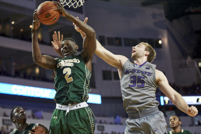 Dec 19, 2015; Wichita, KS, USA; Colorado State Rams forward Emmanuel Omogbo (2) pulls down a rebound over Kansas State Wildcats forward Austin Budke (35) at Intrust Bank Arena. (Gary Rohman/USA To ...
