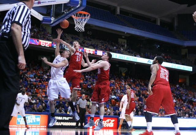 Dec 20, 2015; Boise, ID, USA; Boise State Broncos guard Anthony Drmic (3) puts a shot around Bradley Braves forward Luuk van Bree (13) during second half action  at Taco Bell Arena. Boise State be ...
