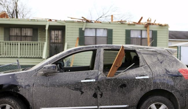 Damage caused by a tornado is seen in a neighborhood in Birmingham, Alabama, December 26, 2015.  REUTERS/Marvin Gentry