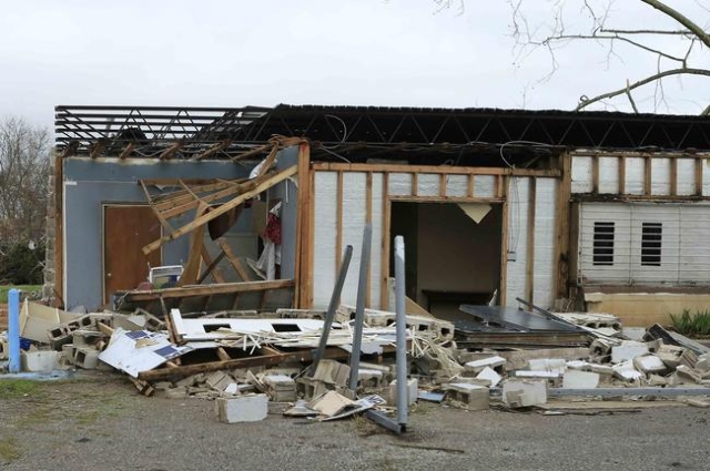 Damage caused by a tornado is seen in a neighborhood in Birmingham, Alabama, December 26, 2015.  REUTERS/Marvin Gentry