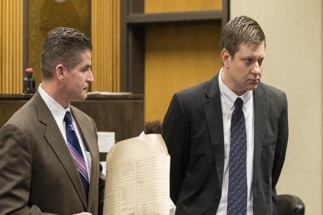 Chicago police officer Jason Van Dyke (R), leaves the courtroom after a hearing with his attorney Daniel Herbert at Leighton Criminal Court Building in Chicago, Illinois in this December 18, 2015, ...