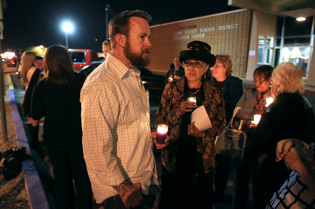 Jason Lamberth talks to Clark County School District trustee Linda Young during a candlelight vigil for his daughter, Hailee Lamberth, Thursday, Dec. 11, 2014. (Sam Morris/Las Vegas Review-Journal ...