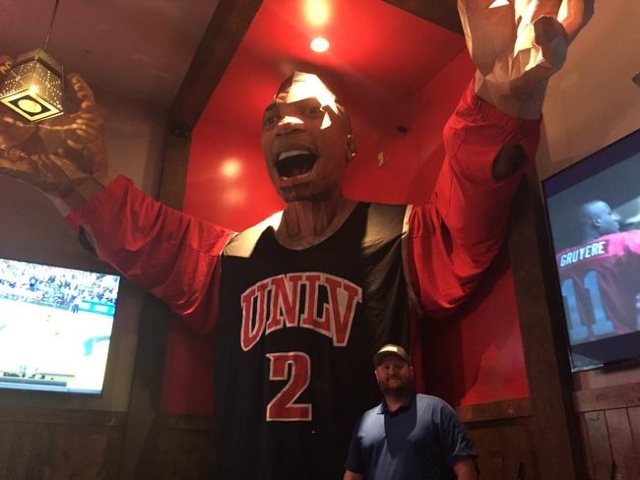 PKWY Tavern General Manager Dave Campion poses in front of Khem Kong on Wednesday, Dec. 2, 2015. The tavern acquired the 20-foot recreation of former Rebel Khem Birch last month from UNLV‘s ...
