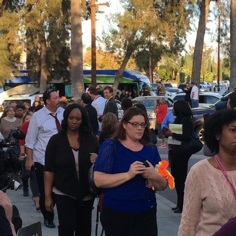 A bus load of survivors from the San Bernardino shooting arrive at a community center to reunite with family. (CNN)