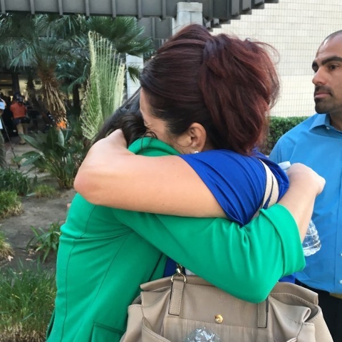 Families hug each other after the San Bernardino shooting. (CNN)