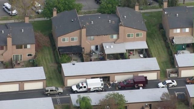 Investigators work on Dec. 3, 2015, at a Redlands home rented by the couple who opened fire in San Bernardino the previous day. (CNN)