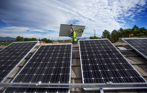 Justin Henderson  with Robco Electric installs solar panels on a home in southwest Las Vegas on Wednesday, Aug. 5, 2015. JEFF SCHEID/LAS VEGAS REVIEW-JOURNAL FOLLOW HIM @JLSCHEID Â°