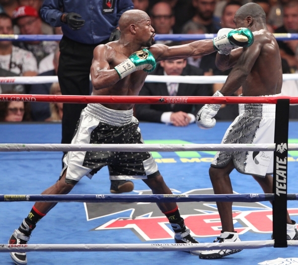 Floyd Mayweather, left, connects a punch against Andre Berto in their WBC/WBA Welterweight Title bout at MGM Grand Garden Arena in Las Vegas Saturday, Sept. 12, 2015. ERIK VERDUZCO/LAS VEGAS REVIE ...
