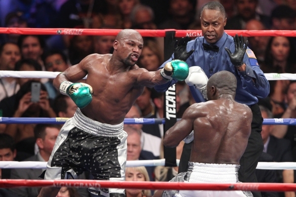 Floyd Mayweather, left, throws a punch against Andre Berto in their WBC/WBA Welterweight Title bout at MGM Grand Garden Arena in Las Vegas Saturday, Sept. 12, 2015. ERIK VERDUZCO/LAS VEGAS REVIEW- ...