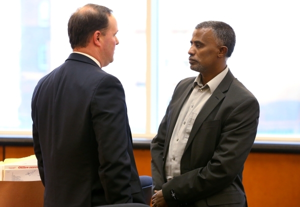 Attorney David O‘Mara, left, talks with Fanuel Gebreyes following a hearing on maintaining life support for Gebreyes‘ 20-year-old daughter in Washoe County District Court in Reno, Nev. ...