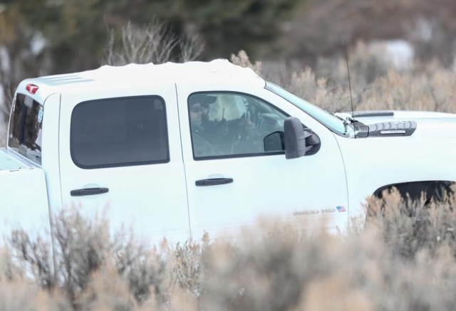 Anti-government protestors drive in a truck at the Malheur National Wildlife Refuge headquarters, which they are occupying, near Burns, Ore. on Monday, Jan. 4, 2016. The protestors, many of them a ...