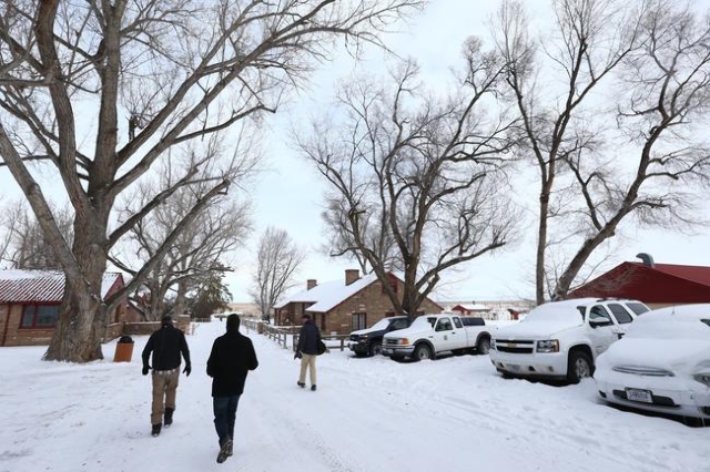News media members walk through the Malheur National Wildlife Refuge headquarters, which is occupied by anti-government protestors, near Burns, Ore. on Monday, Jan. 4, 2016. The protestors, many o ...