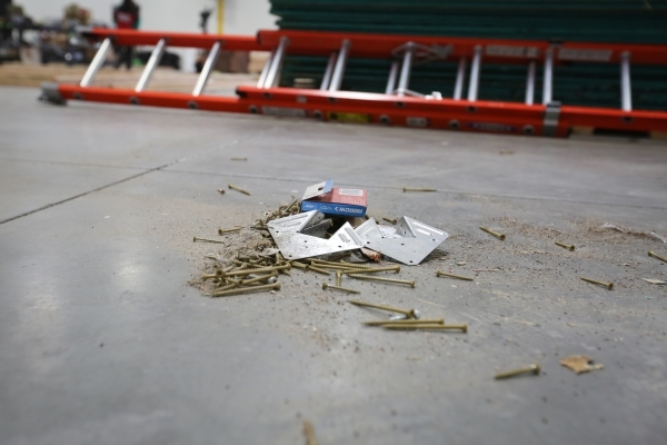 Screws from training buildings sit on the floor at the SolarCity training facility in Las Vegas on Tuesday, Jan. 5, 2016. SolarCity decided to shutter its Nevada-based installation and sales after ...