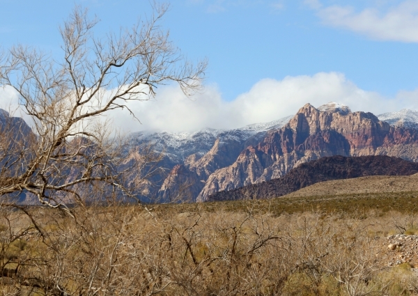 Clouds float over the mountains at a snow-topped Red Rock Canyon National Conservation Area Wednesday, Jan. 6, 2016, near Las Vegas. Ronda Churchill/Las Vegas Review-Journal