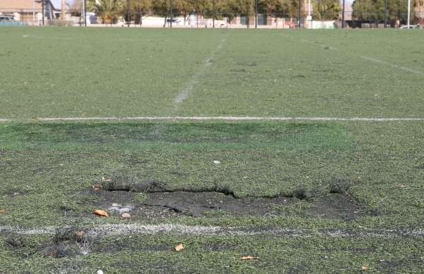 Damaged artificial turf soccer field at 5800 Surrey Street, Near Russell Road between Maryland Parkway and Eastern Avenue is seen on Friday, Jan. 8, 2016. Two soccer fields near McCarran Airport h ...