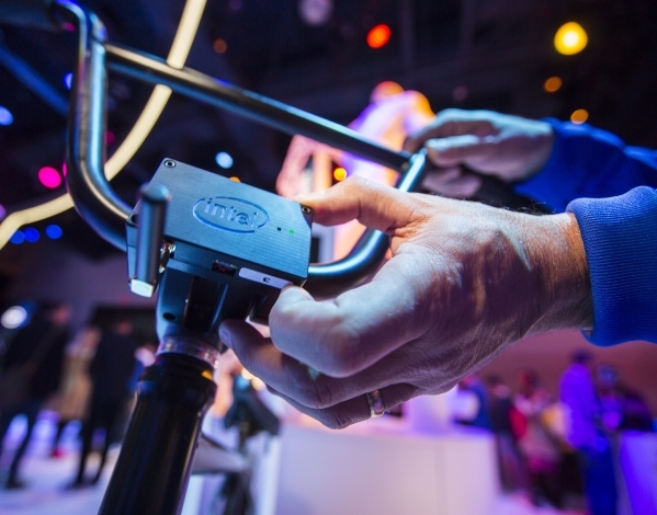 Gary Klein touches the module on the Smart BMX bike at the Intel booth during CES in the Las Vegas Convention Center on Friday, Jan. 8,2016. An Intel microcomputer attached to the bike captures da ...