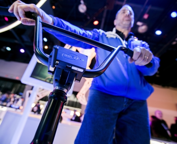 Gary Klein explains the Smart BMX bike at the Intel booth during CES in the Las Vegas Convention Center on Friday, Jan. 8,2016. An Intel microcomputer attached to the bike captures data of the rid ...