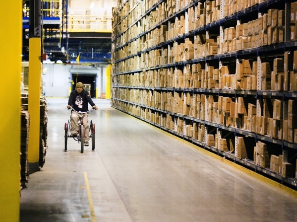 A man bicycles in the  Levi Strauss & Company‘s Sky Harbor Distribution Center, 501 Executive Airport Drive, in Henderson on Thursday, Jan. 7,2016. The one million square foot  distribut ...