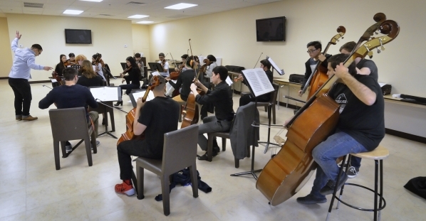 Yunior Lopez, left, conducts during a Young Artists Orchestra rehearsal at the Adelson Clinic at 3661 Maryland Parkway in Las Vegas on Friday, Jan. 15, 2016. Bill Hughes/Las Vegas Review-Journal