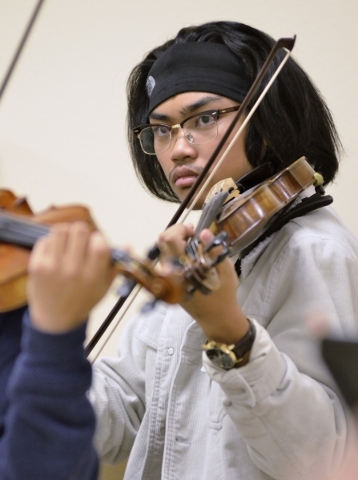 Justin Lopez performs during a Young Artists Orchestra rehearsal at the Adelson Clinic at 3661 Maryland Parkway in Las Vegas on Friday, Jan. 15, 2016. Bill Hughes/Las Vegas Review-Journal