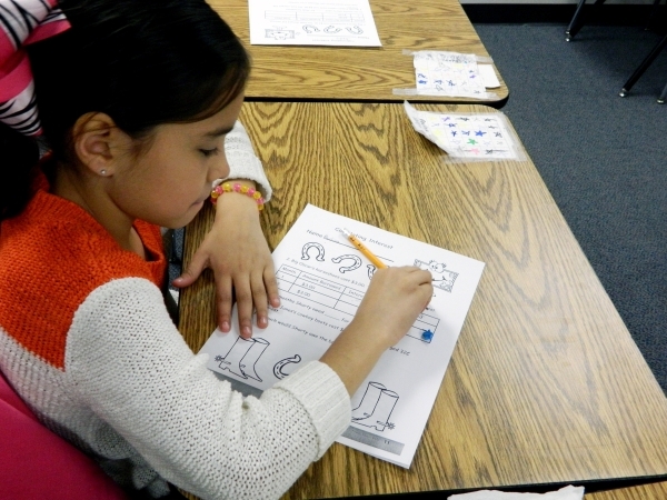Third-grader Paulina Vallejo participates in a financial literacy class Jan. 11 at McCaw Elementary School. Cassandra Keenan/View