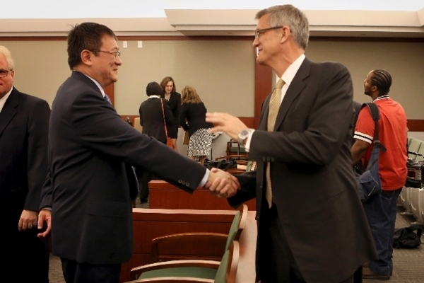 Hong Kong businessman Richard Suen, left, talks with Steven Jacobs, former Las Vegas Sands China CEO, in 2013 at the Regional Justice Center before opening statements in Suen‘s lawsuit again ...