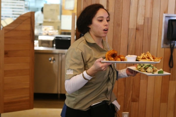 Server Kendra Montes delivers food to a customer at Sprocket bar and restaurant on Friday, Jan. 15, 2016, in Henderson, Nev. Erik Verduzco/Las Vegas Review-Journal Follow @Erik_Verduzco