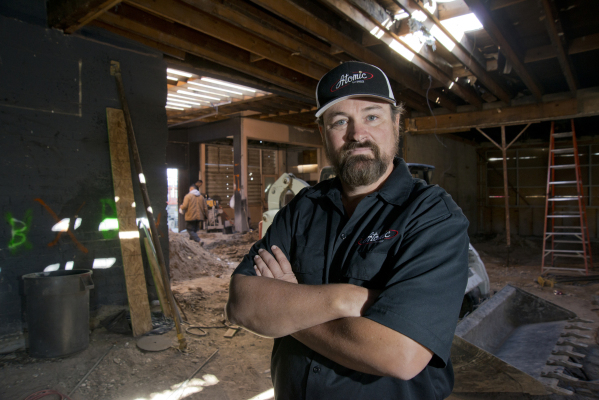 Lance Johns poses for a portrait inside the garage he is currently renovating into Atomic Kitchen, immediately next door to Atomic Liquors, in Downtown Las Vegas on Friday, Jan. 15, 2016. His proj ...