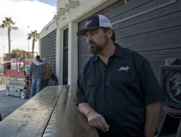 Lance Johns stands outside the garage he is currently renovating into Atomic Kitchen, immediately next door to Atomic Liquors, in Downtown Las Vegas on Friday, Jan. 15, 2016. His project is experi ...